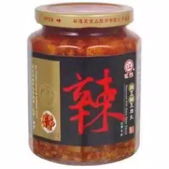 Spicy preserved vegetable in glass jar