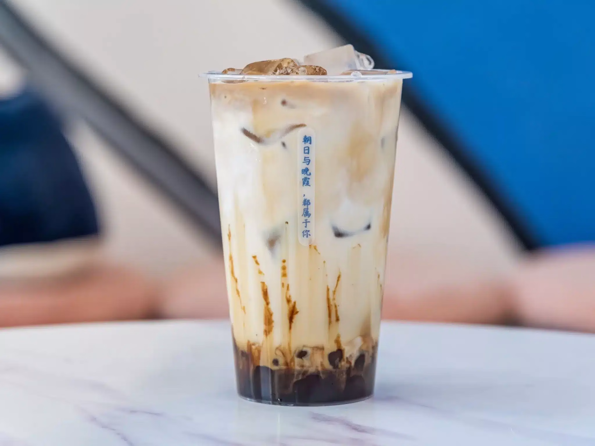 Iced brown sugar bubble milk tea in plastic cup