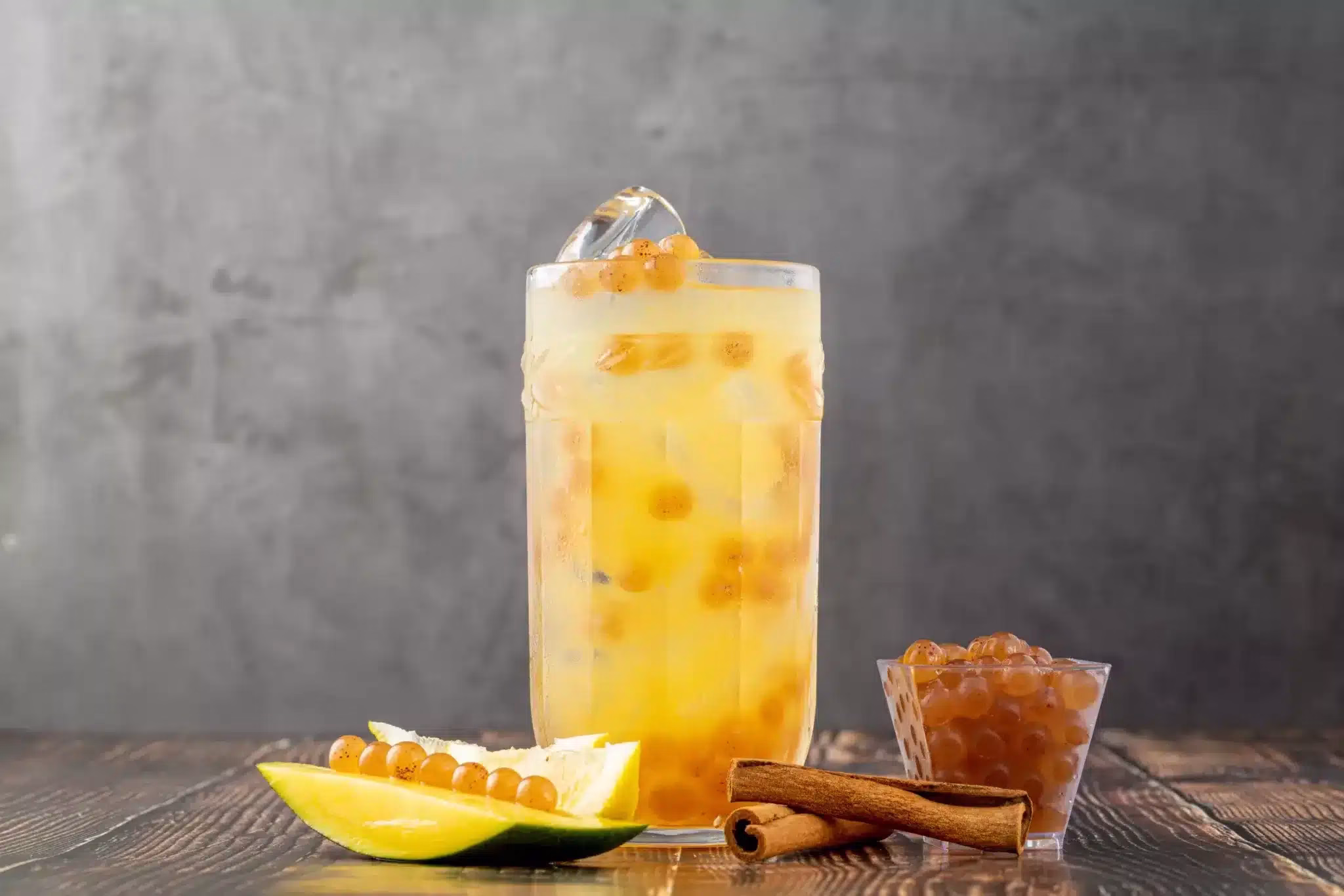 Fruity Bubble Tea in glass cup on dark background