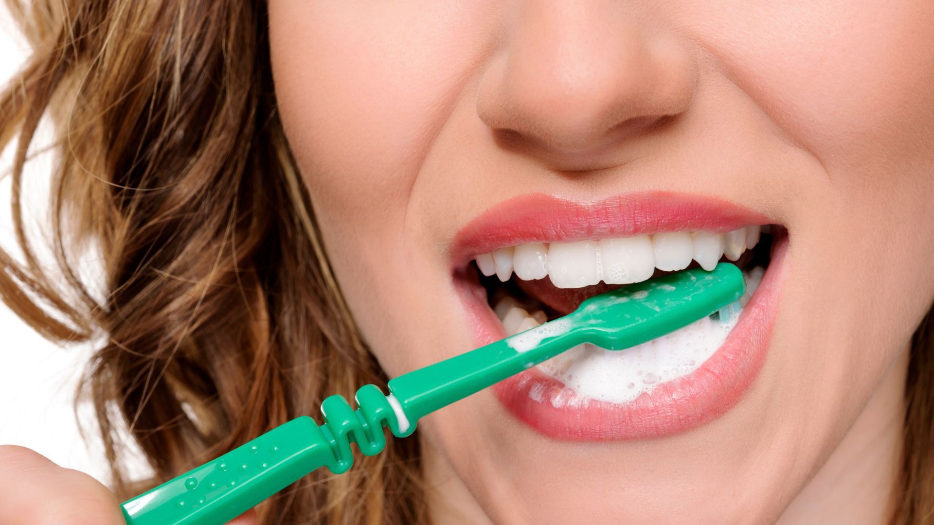 lady brushing their teeth