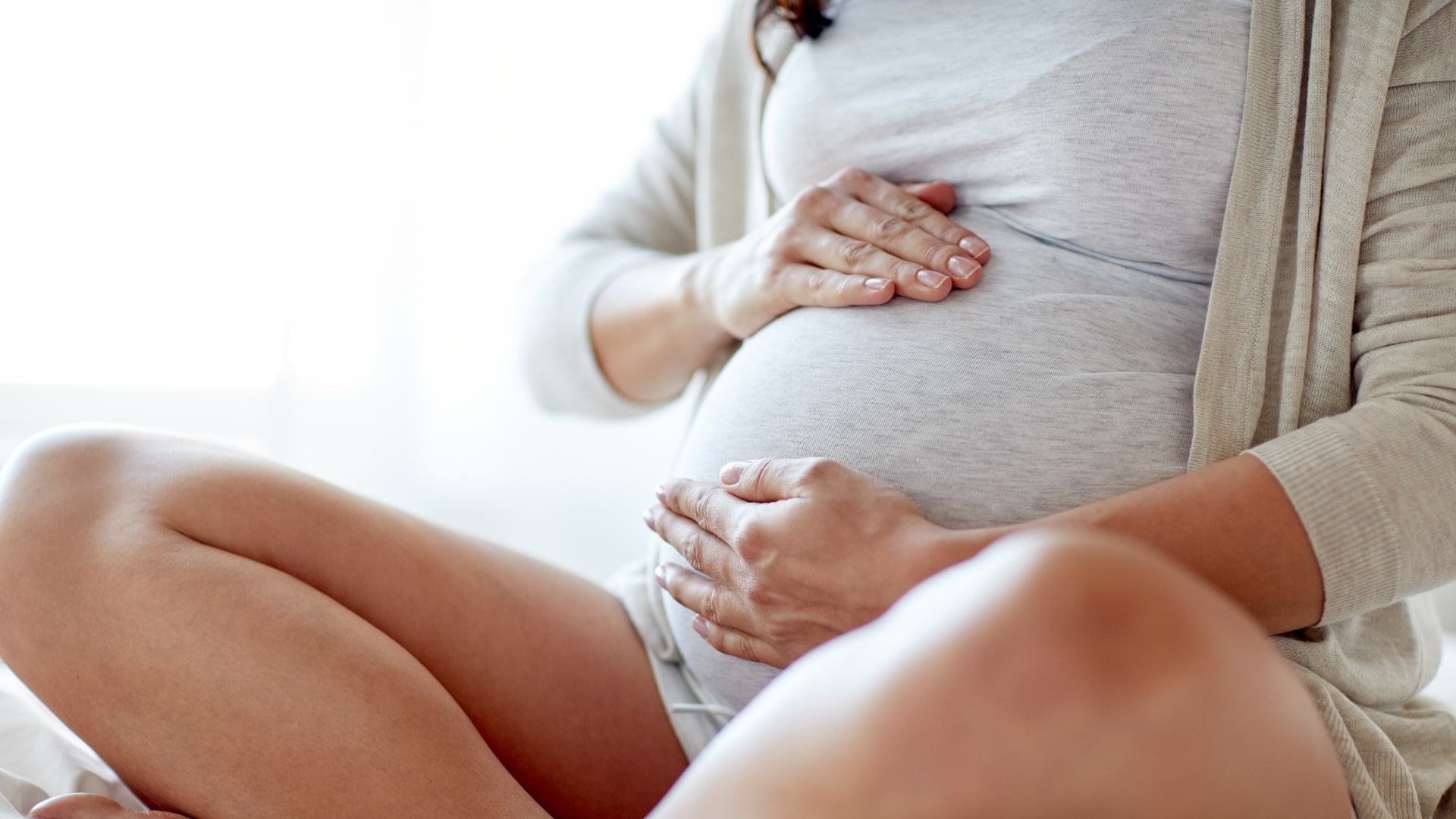 pregnant lady holding tummy