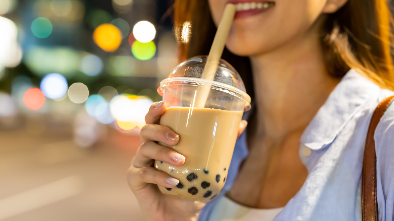 happy customer with bubble tea in her hand