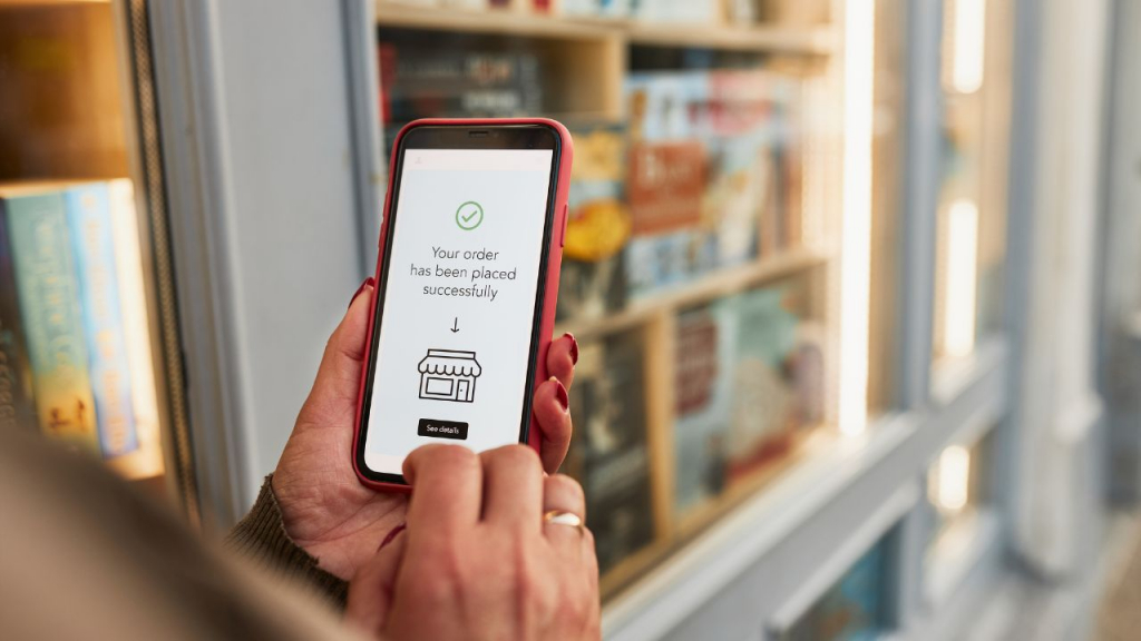 Person confirming order on a mobile phone screen